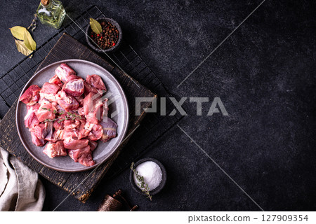 Raw chopped meat with spices Raw chopped meat with spices 127909354