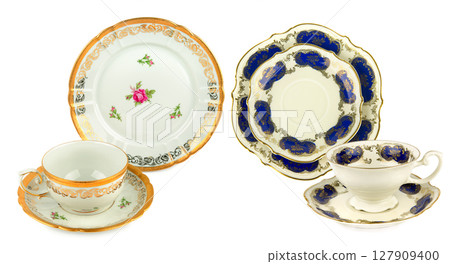 Porcelain vintage cup and saucer isolated on white background. Porcelain vintage cup and saucer isolated on white background. 127909400