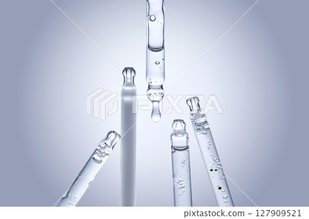 Five different droppers with facial serum. Five different droppers with facial serum. 127909521