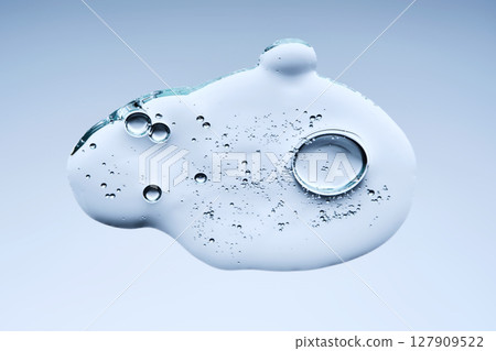 A beautiful swatch of hyaluronic serum with bubbles on a blue background. View from below. 127909522