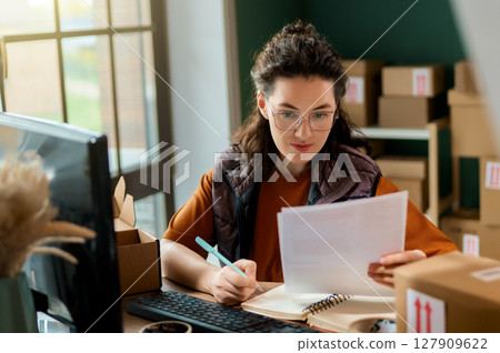 Woman working in a warehouse Woman working in a warehouse 127909622