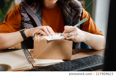 Woman working in a warehouse Woman working in a warehouse 127909623