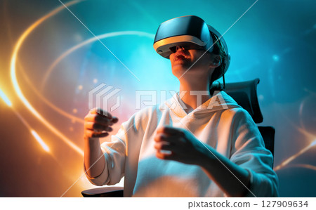 Woman with VR virtual reality goggles 127909634