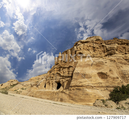 Mountains of Petra (against the background of a beautiful sky with clouds), Jordan, Middle East. Petra has been a UNESCO World Heritage Site since 1985 127909717