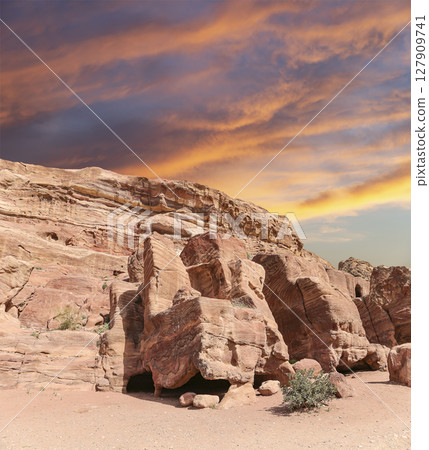 Mountains of Petra (against the background of a beautiful sky with clouds), Jordan, Middle East. Petra has been a UNESCO World Heritage Site since 1985 Mountains of Petra (against the background of a beautiful sky with clouds), Jordan, Middle East. Petra has been a UNESCO World Heritage Site since 1985 127909741