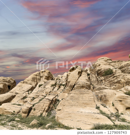 Mountains of Petra (against the background of a beautiful sky with clouds), Jordan, Middle East. Petra has been a UNESCO World Heritage Site since 1985 127909743
