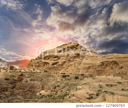 Mountains of Petra (against the background of a beautiful sky with clouds), Jordan, Middle East. Petra has been a UNESCO World Heritage Site since 1985 127909765