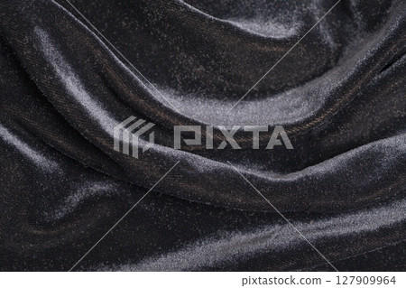 Black velvet fabric with folds Black velvet fabric with folds 127909964