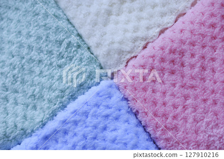Background of colorful towels. Several soft terry towels. Background of colorful towels. Several soft terry towels. 127910216