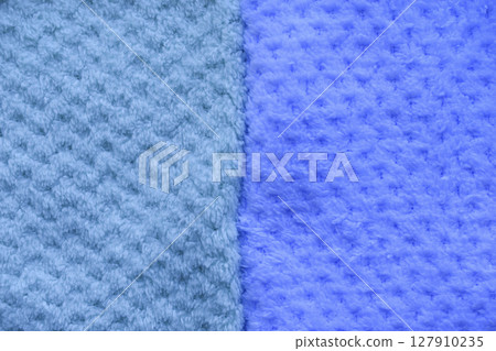 Background of colorful towels. Several soft terry towels. 127910235