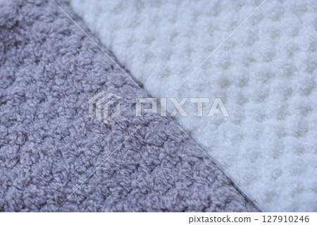 Background of colorful towels. Several soft terry towels. 127910246