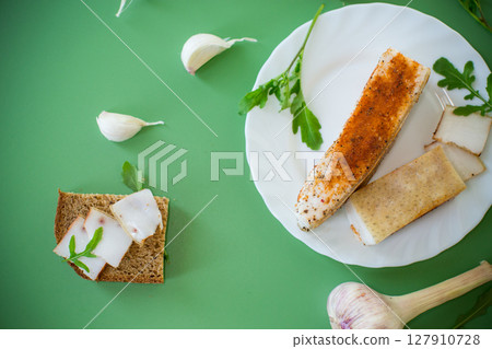 Sandwich with lard on rye bread and green onions on top Sandwich with lard on rye bread and green onions on top 127910728