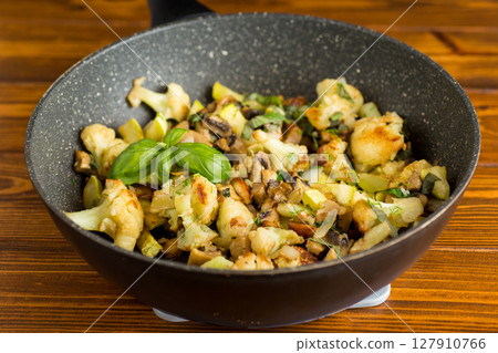 Hot dish of cauliflower and champignons Hot dish of cauliflower and champignons 127910766