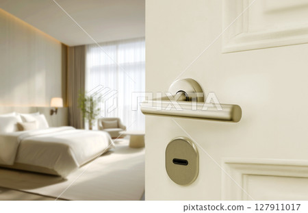 Opened White door of hotel room with blurred bedroom background 127911017
