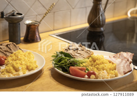 breakfast for two omelette with vegetables and a sandwich with pate 127911089