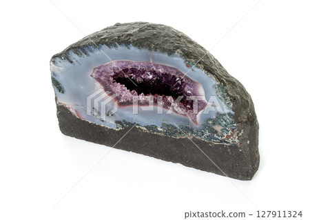 Amethyst Crystal Druse macro mineral on white background Amethyst Crystal Druse macro mineral on white background 127911324