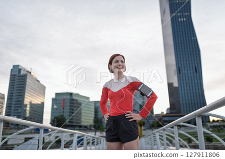 Sporty woman runner preparing for morning training, stretching. Sporty woman runner preparing for morning training, stretching. 127911806