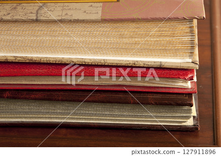 old photo album are stacked on top of each other old photo album are stacked on top of each other 127911896