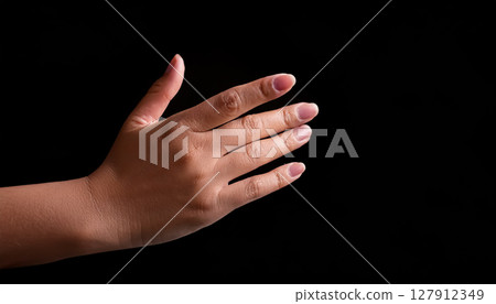 A woman's hand extended sideways / A gesture that gives a sense of softness and expressiveness 127912349