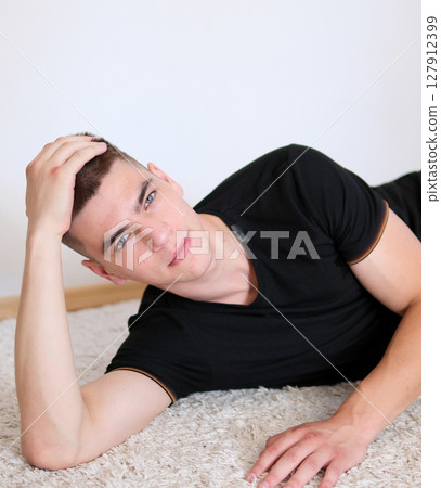 Handsome student working at startup project at home Handsome student working at startup project at home 127912399