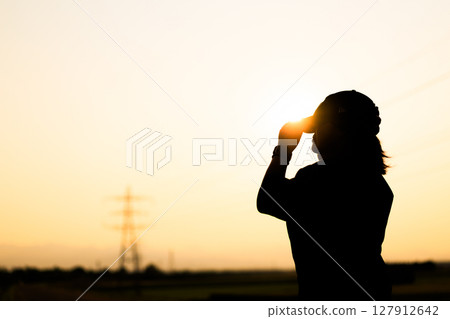 Sunset and silhouette 127912642