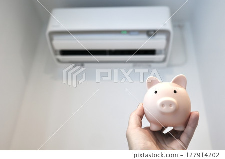 Save money with air conditioners and piggy banks 127914202