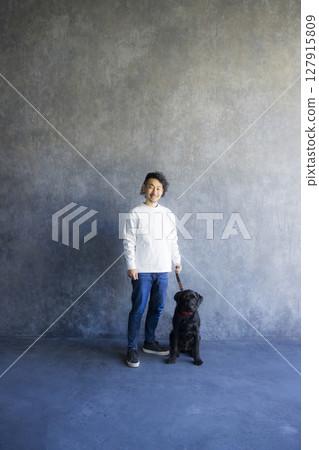 Man relaxing with his dog 127915809