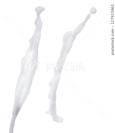 Milk yogurt white water droplet shape form fly splashing. Milk lotion pour float in mid air. Milk moisturizer explosion throw fluttering. White background isolated high speed shutter freeze motion Milk yogurt white water droplet shape form fly splashing. Milk lotion pour float in mid air. Milk moisturizer explosion throw fluttering. White background isolated high speed shutter freeze motion 127915963