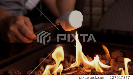 Marshmallow Roasting Over Open Fire for a Sweet Treat, Cozy Evening, and Summertime Fun Marshmallow Roasting Over Open Fire for a Sweet Treat, Cozy Evening, and Summertime Fun 127917877