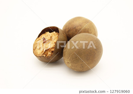 Three Monk Fruits and their contents arranged on a white background 127919060