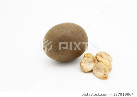 A single Monk fruit and dried fruits arranged on a white background 127919064