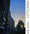 Portrait view of tall modern apartments during blue hour evening 127919360