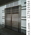 Rusty galvanized scissor folding gate for entrance protection safety 127919364