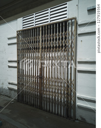 Rusty galvanized scissor folding gate for entrance protection safety Rusty galvanized scissor folding gate for entrance protection safety 127919364