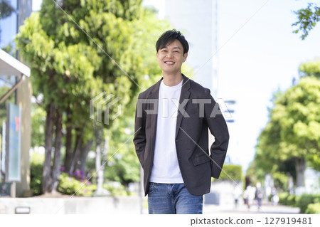 A man in his early 40s smiling at the camera 127919481