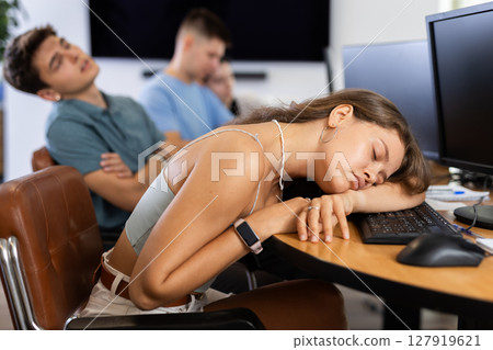 Exhausted students find solace in sleep 127919621