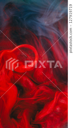 Fume water. Cloud vapor. Defocused blue red colorful paint glitter flowing vibrant liquid spreading on abstract acrylic background. 127919719