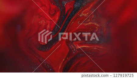 Paint drip. Ink water. Defocused red golden color splash glitter texture flowing dark black stains spreading on abstract bokeh background. 127919725