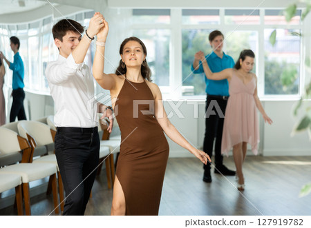 Young people dancing paired slow waltz dance in choreographic studio 127919782