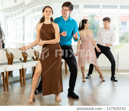 Incendiary swing dance performed by young people in dance studio 127920242