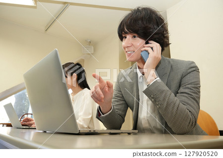 Male speaking on the phone 127920520