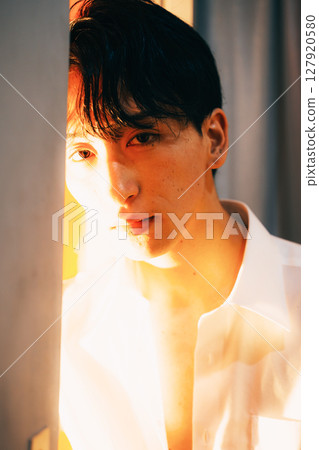 Korean style young businessman white shirt portrait in evening light Korean style young businessman white shirt portrait in evening light 127920580