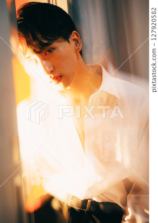 Korean style young businessman white shirt portrait in evening light 127920582