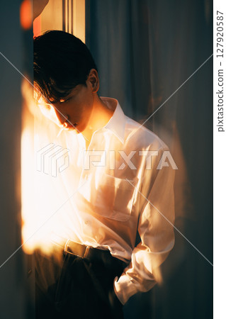 Korean style young businessman white shirt portrait in evening light 127920587