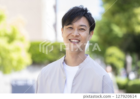 A man in his 40s smiling at the camera A man in his 40s smiling at the camera 127920614
