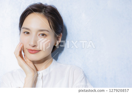 Woman in white blouse Woman in white blouse 127920857