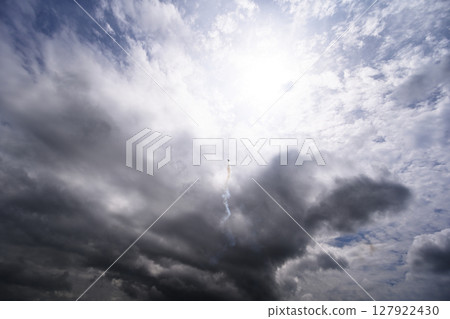 A plane soaring into the sky 127922430