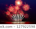 Fireworks celebration and the city night light background. 127922598