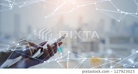 Woman using smartphone and communication network concept 127923023