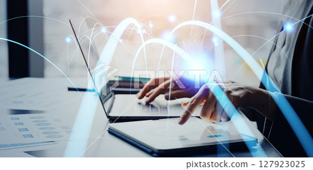 Communication network concept with business people using digital devices in office 127923025